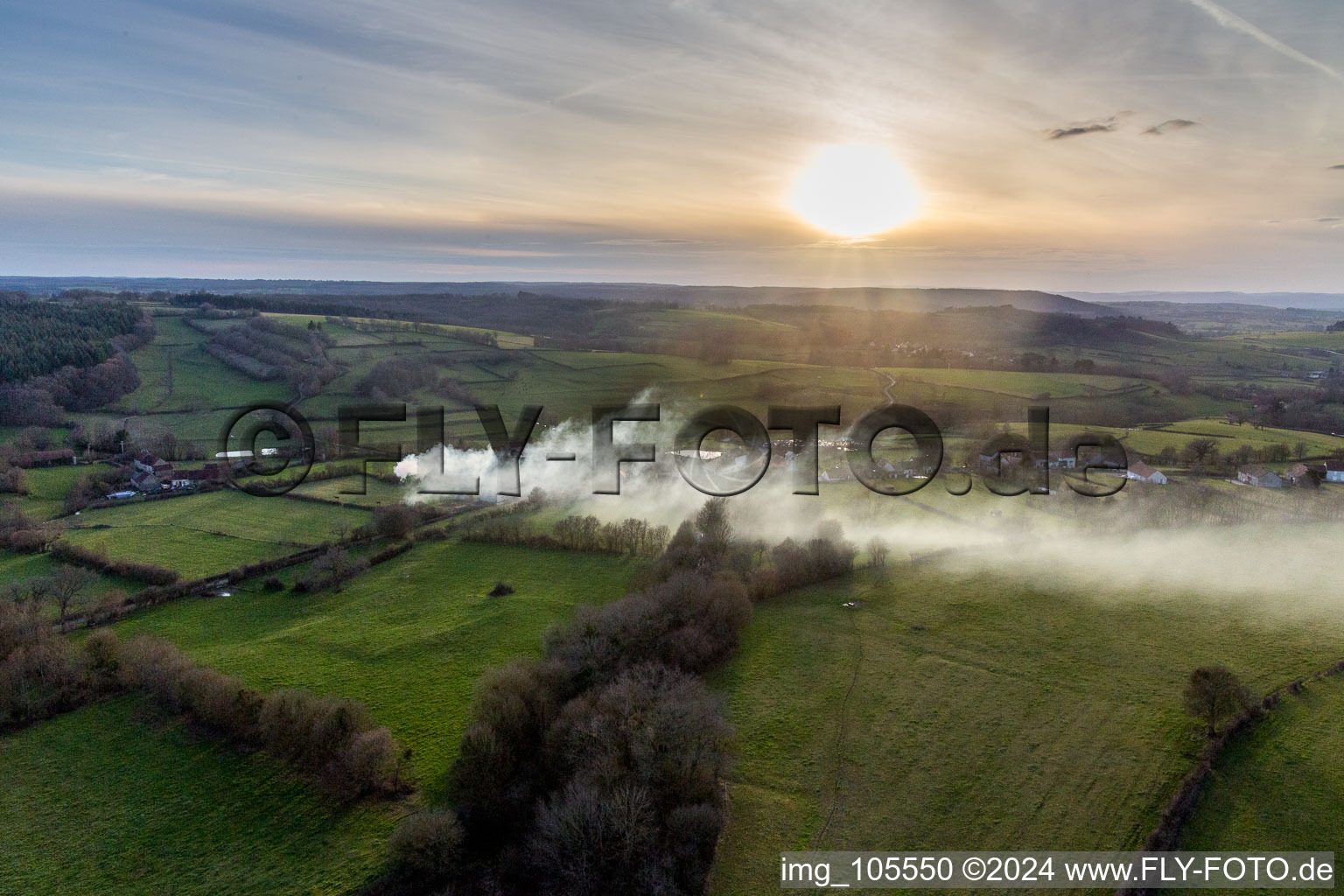 Smoke clouds of a fire in a cornfield in Saisy in Bourgogne-Franche-Comte, France