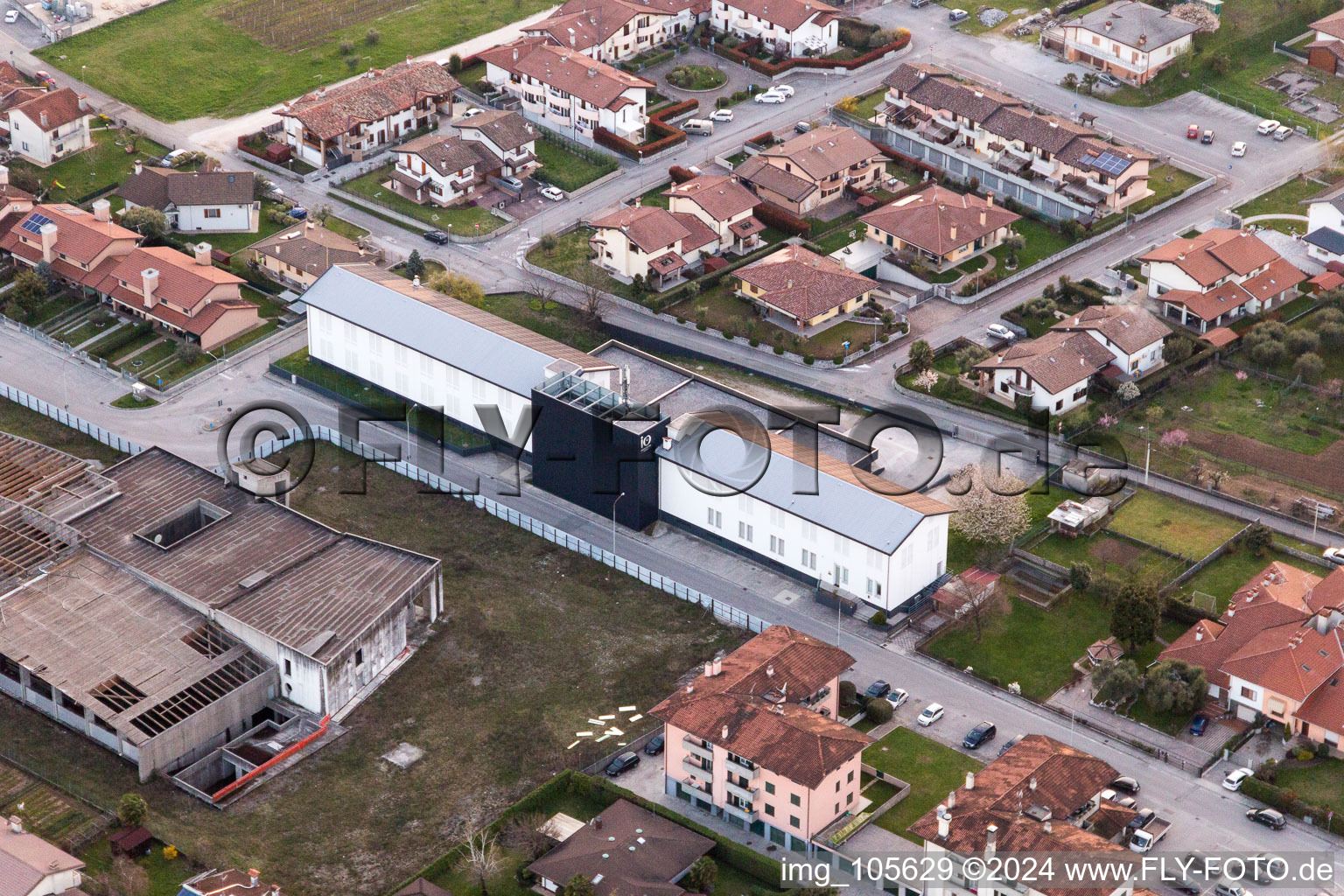 Aerial view of Warehouse complex-building in the industrial area of Prosciuttificio Friulano und Leoncini Prosciutti in San Daniele del Friuli in Friuli-Venezia Giulia, Italy