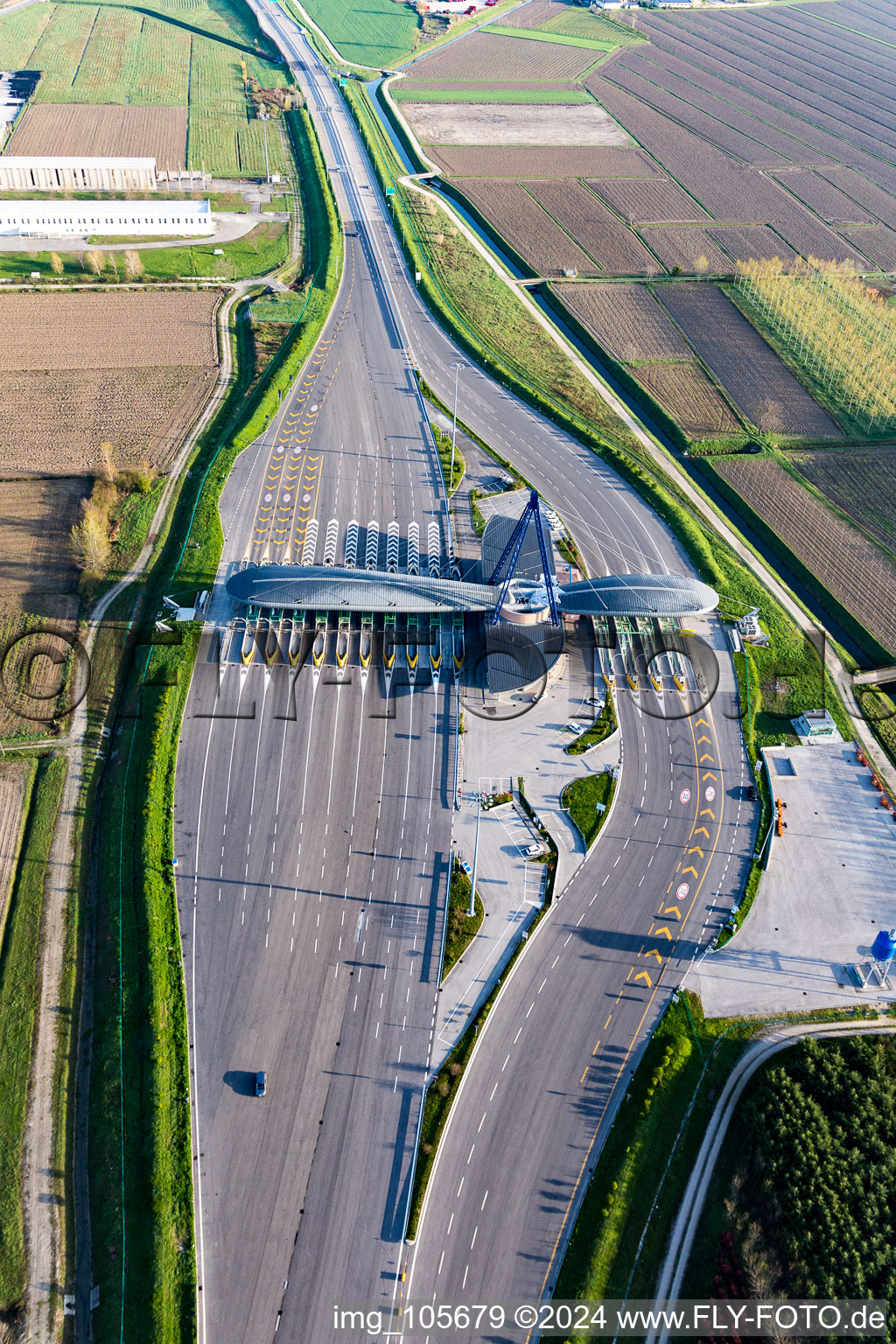 Aerial view of Highway toll station and paying agent of the A 4 (Punto Blu) in Ronchis in Friuli-Venezia Giulia, Italy