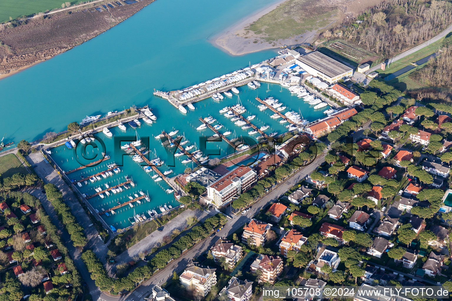 Pleasure boat marina with docks and moorings on the shore area in Lignano Sabbiadoro in Friuli-Venezia Giulia, Italy