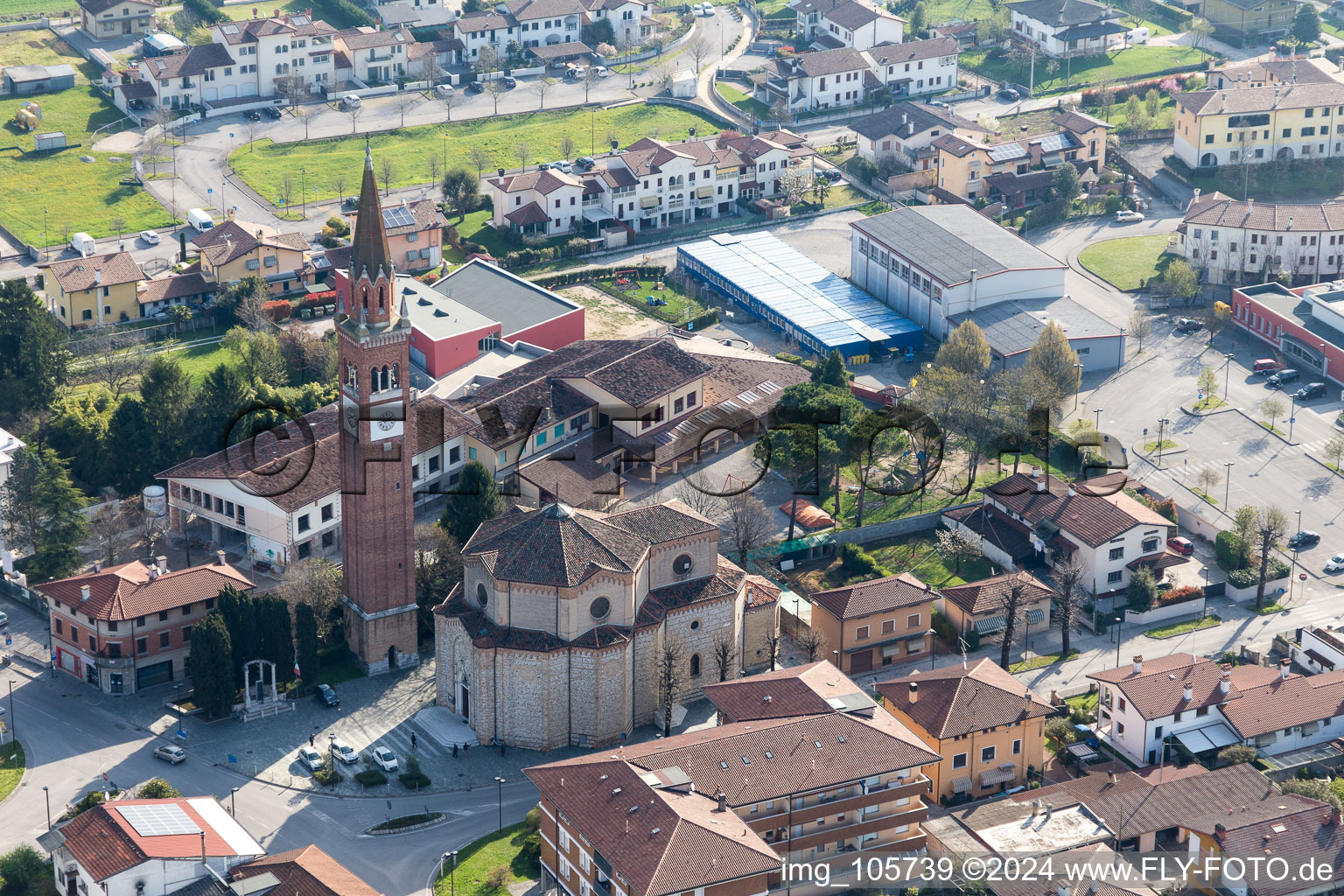 Church tower and tower roof at the church building of Chiesa delle Sante Perpetua e Felicita in Fiume Veneto in Friuli-Venezia Giulia, Italy
