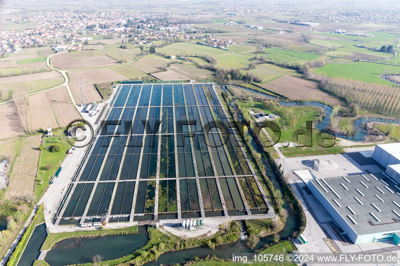 Shore areas of the ponds for fish farming von Icos professional in Zoppola in Friuli-Venezia Giulia, Italy