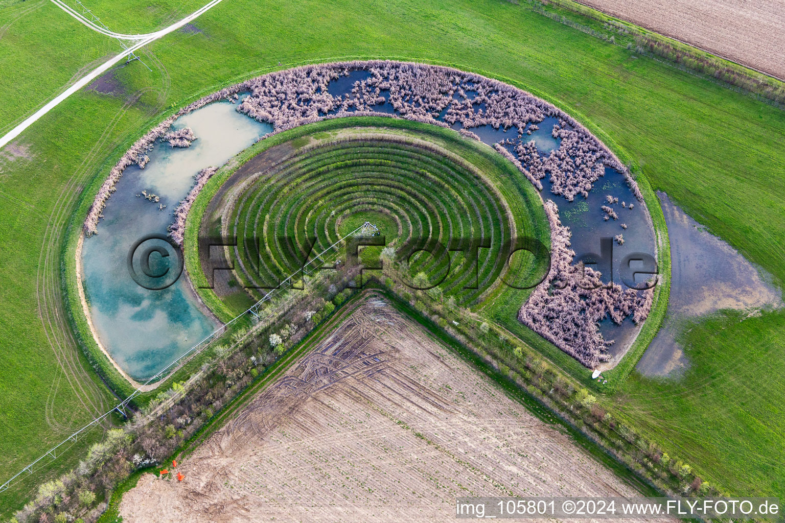 Circular round arch of a pivot irrigation system on agricultural fields in Pavia di Udine in Friuli-Venezia Giulia, Italy