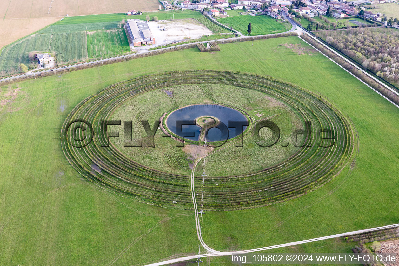 Circular round arch of a pivot irrigation system on agricultural fields in Persereano in Friuli-Venezia Giulia, Italy