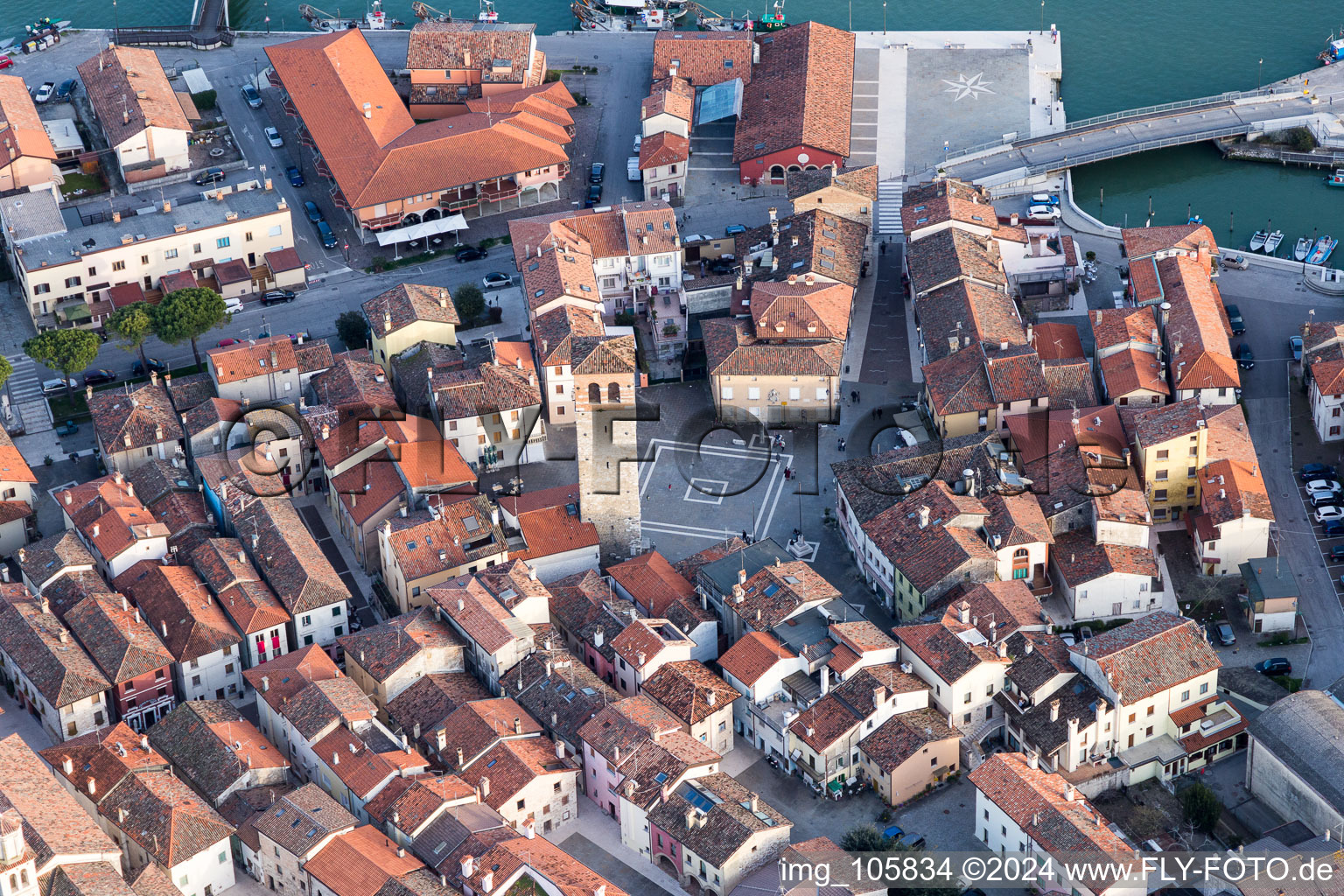 Aerial photograpy of Water surface at the seaside mole of in Marano Lagunare in Friuli-Venezia Giulia, Italy