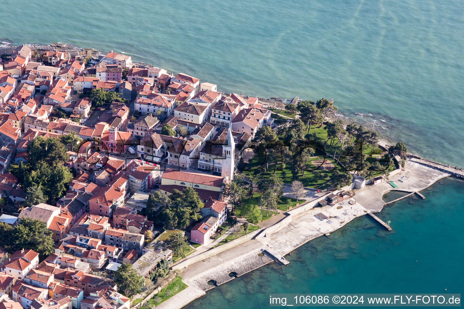 Pleasure boat marina with docks and moorings on the shore area of the Adriatic sea and old town of Novigrad in Istrien - Istarska zupanija, Croatia