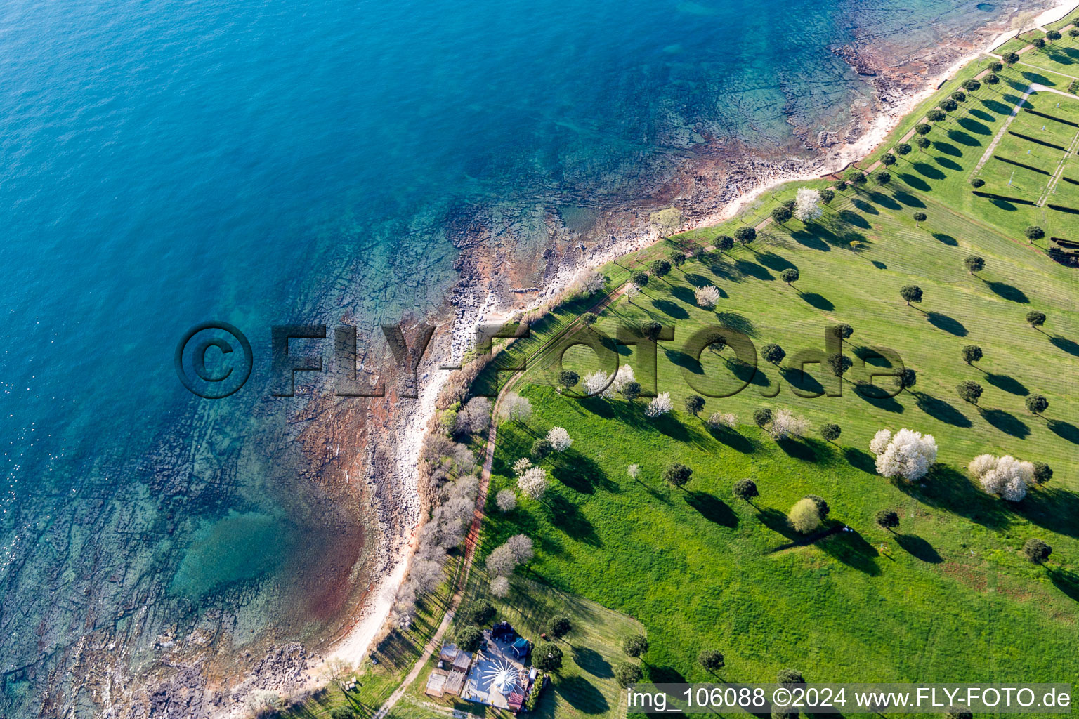 Stony beach landscape on the coast of Adria with Camping Park Umag Mobile Homes in Karigador in Istria- Istarska zupanija, Croatia