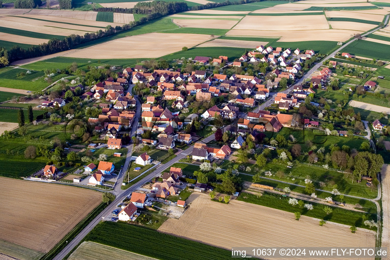 Oblique view of Village - view on the edge of agricultural fields and farmland in Hoffen in Grand Est, France