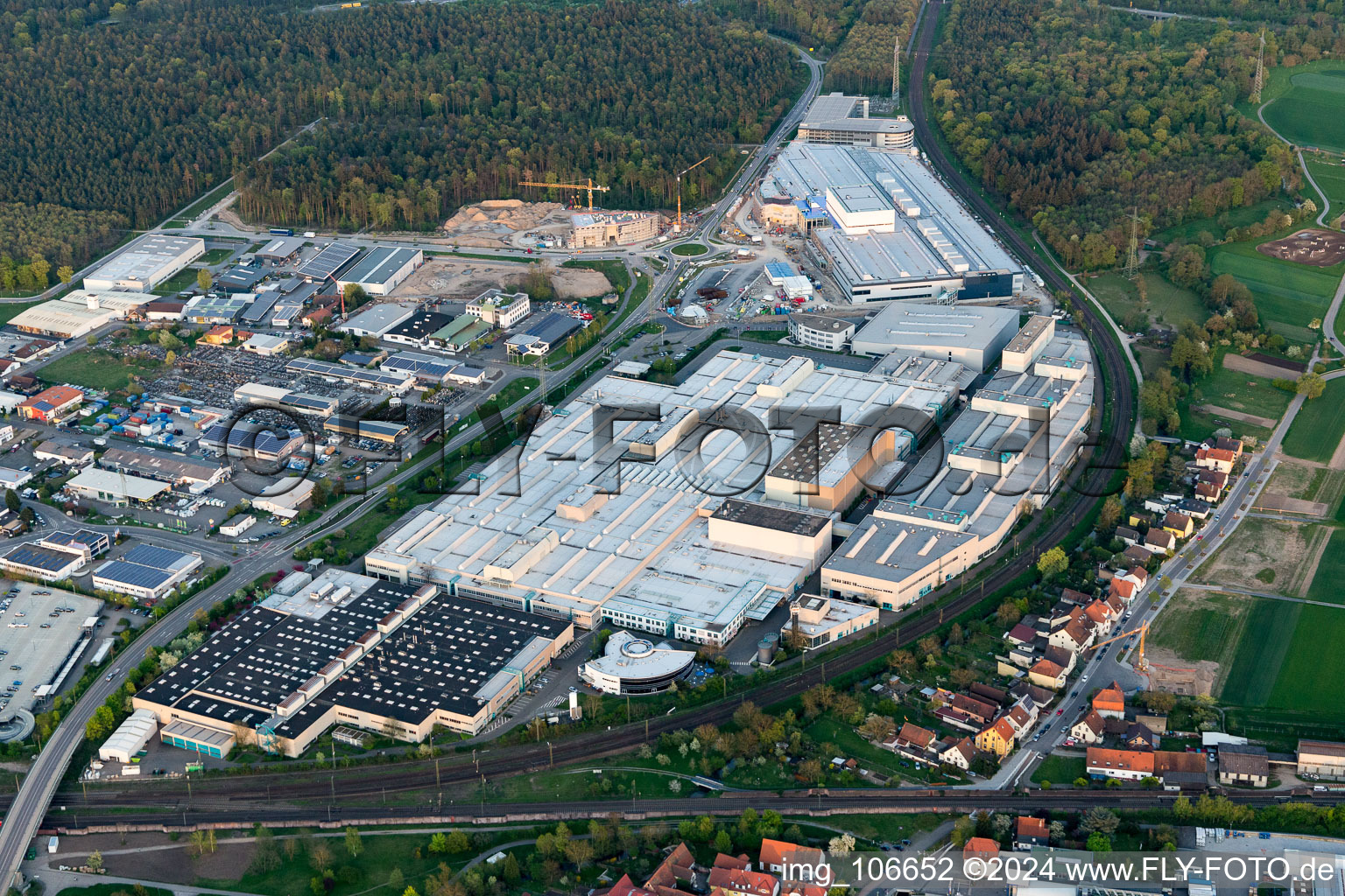 Extension - new building - construction site on the factory premises of SEW-EURODRIVE GmbH & Co KG in Graben-Neudorf in the state Baden-Wurttemberg, Germany viewn from the air