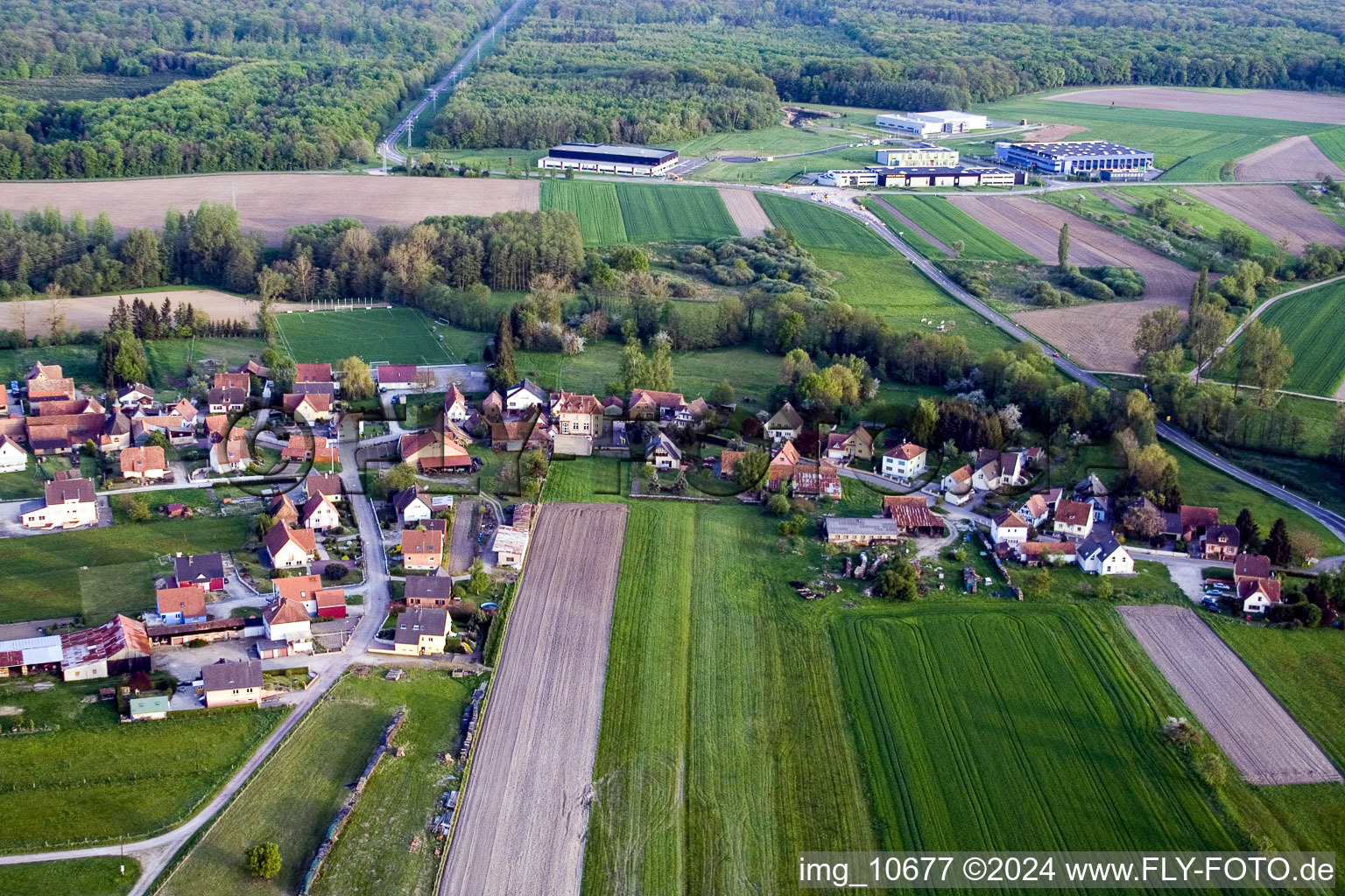 Village - view on the edge of agricultural fields and farmland in the district Hinterfeld in Walbourg in Grand Est, France