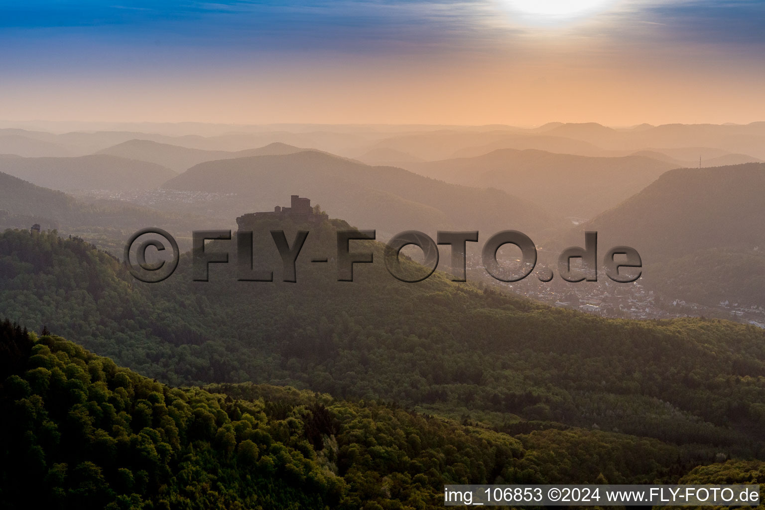 Castle complex of Veste Trifels in the evening haze above the Palatinate Forest in Annweiler am Trifels in the state Rhineland-Palatinate, Germany