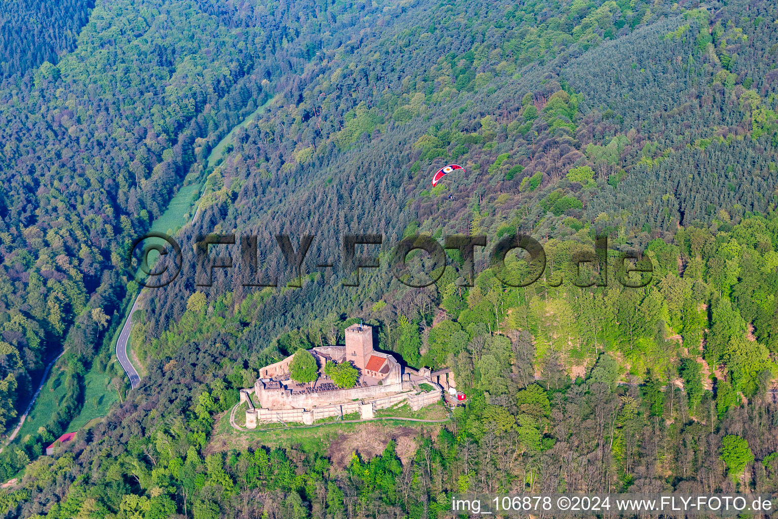 Aerial view of Landeck ruins with paraglider in Klingenmünster in the state Rhineland-Palatinate, Germany