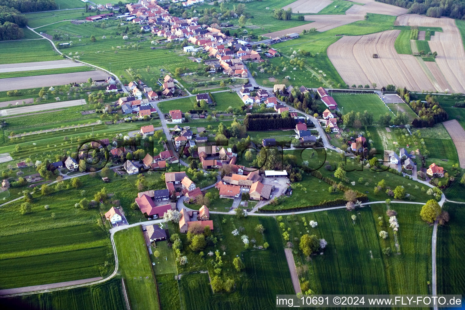 Village - view on the edge of agricultural fields and farmland in Laubach in Grand Est, France