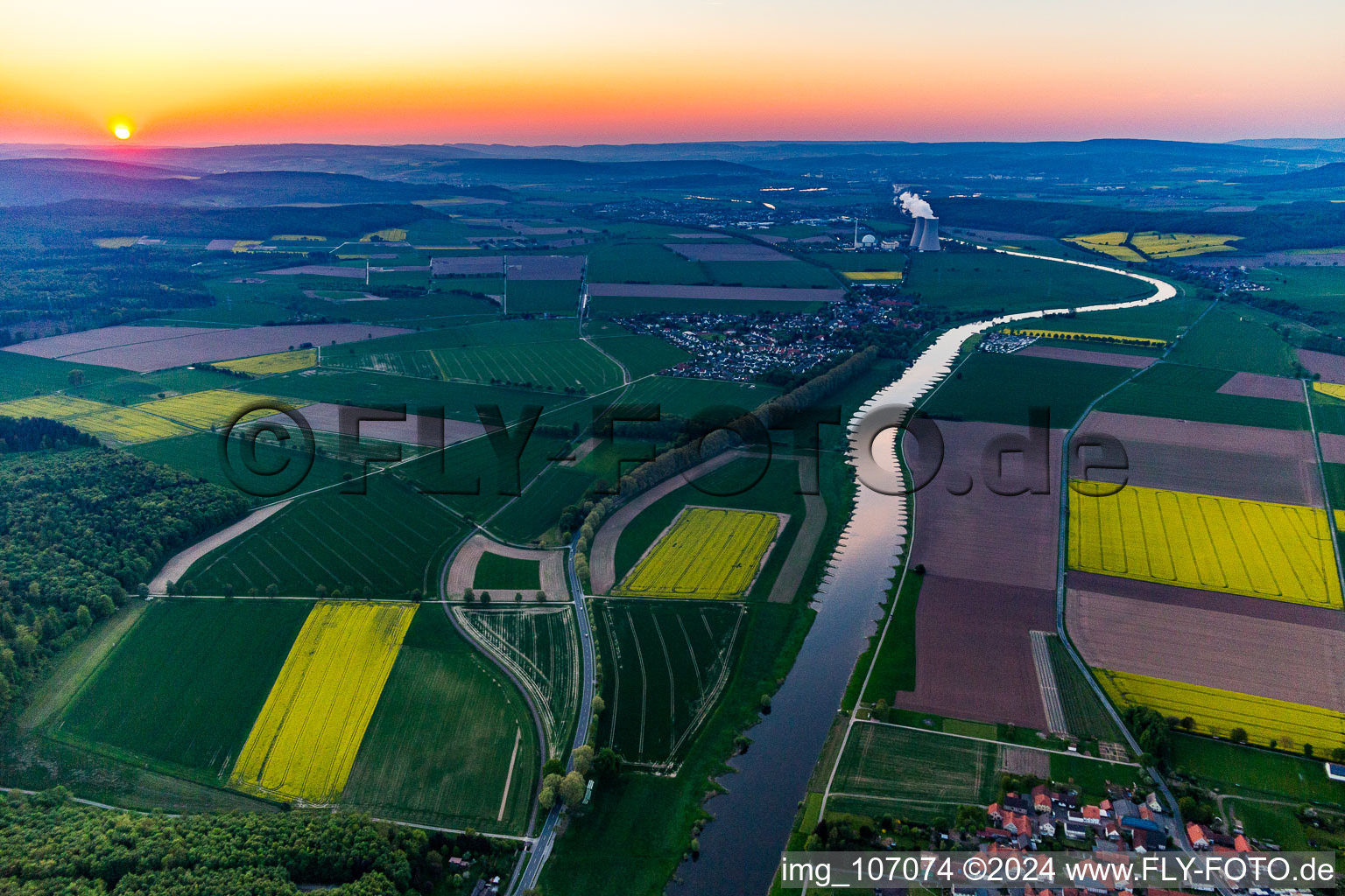 Aerial view of Nuclear power plant Grohnde from a distance at sunset in the district Grohnde in Emmerthal in the state Lower Saxony, Germany