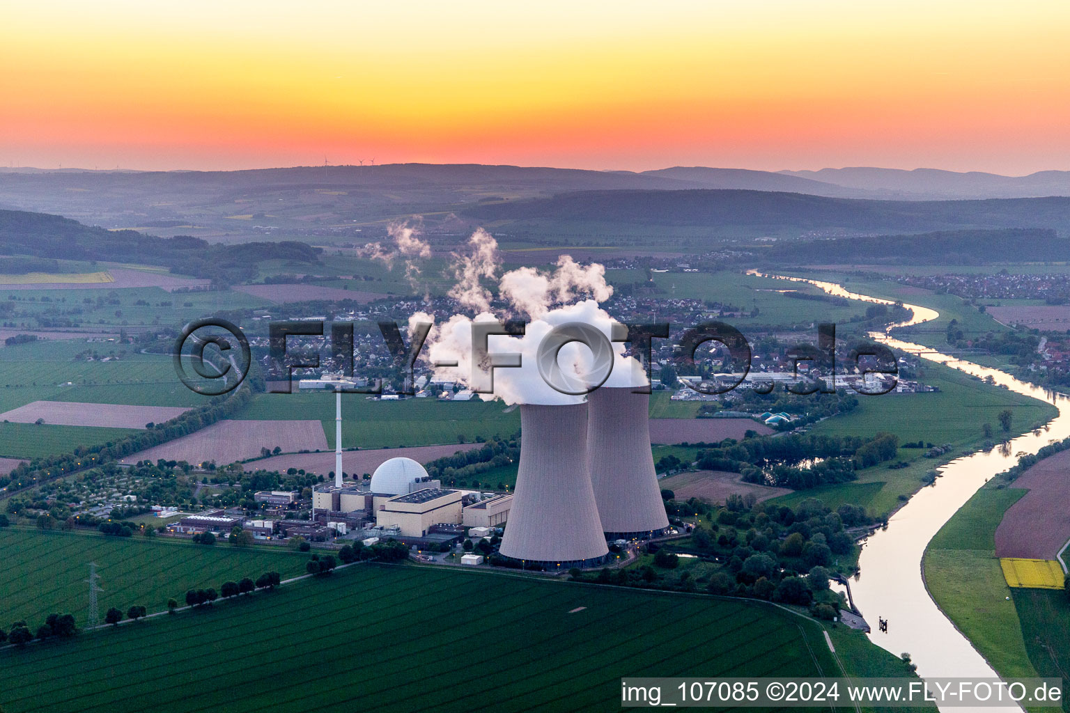 Building remains of the reactor units and facilities of the NPP nuclear power plant Grohnde on the river Weser during sunset in Grohnde in the state Lower Saxony, Germany