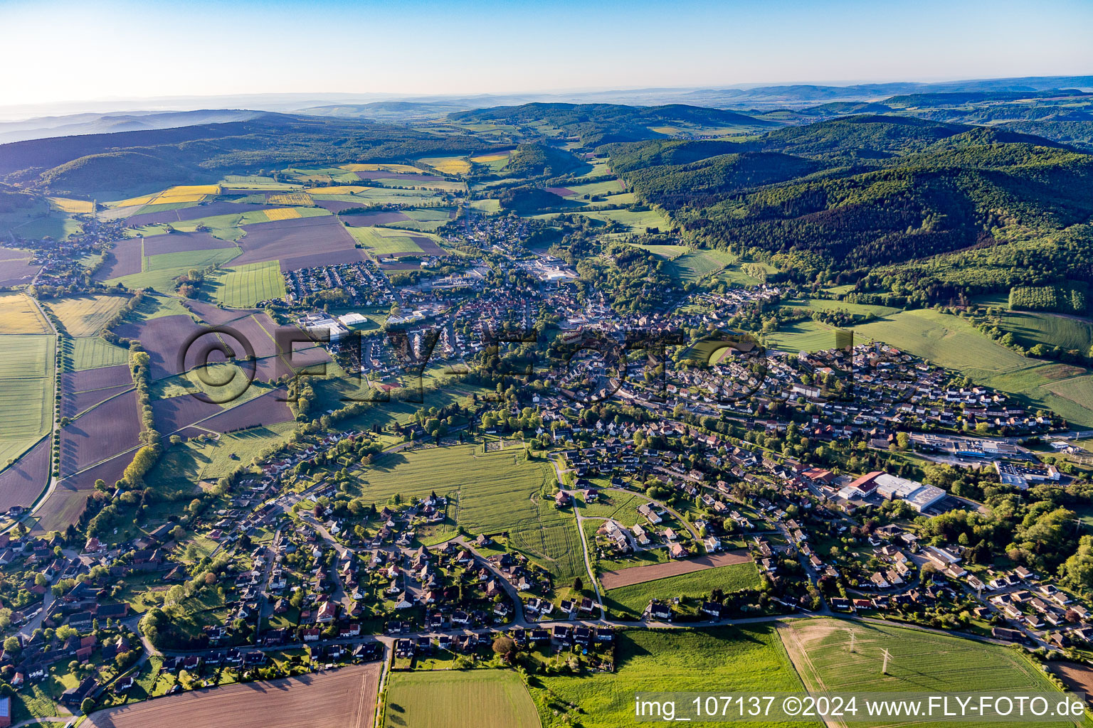 Village view on the edge of agricultural fields and land in Eschershausen in the state Lower Saxony, Germany