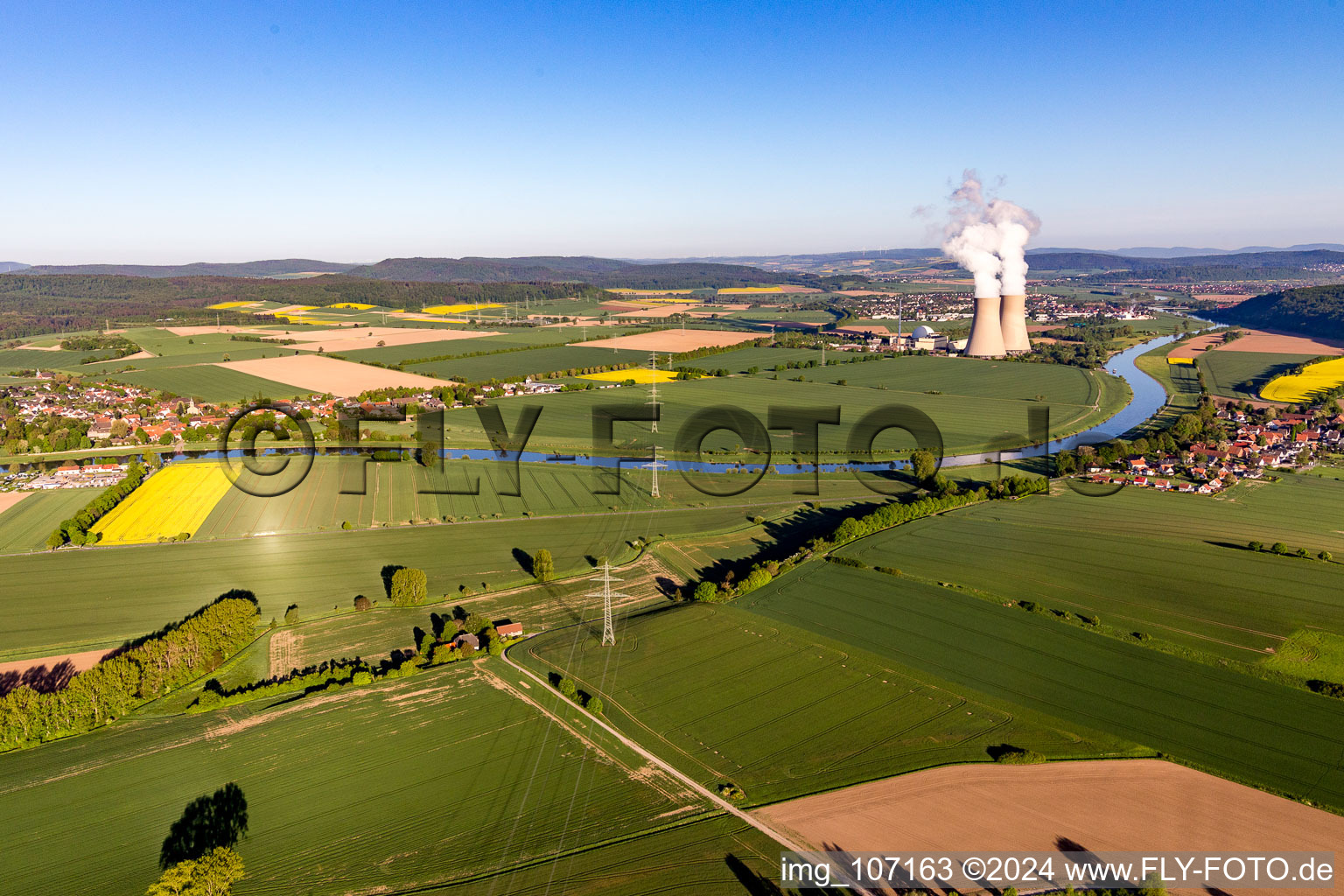 Aerial photograpy of Building remains of the reactor units and facilities of the NPP nuclear power plant Grohnde on the river Weser during sunset in Grohnde in the state Lower Saxony, Germany