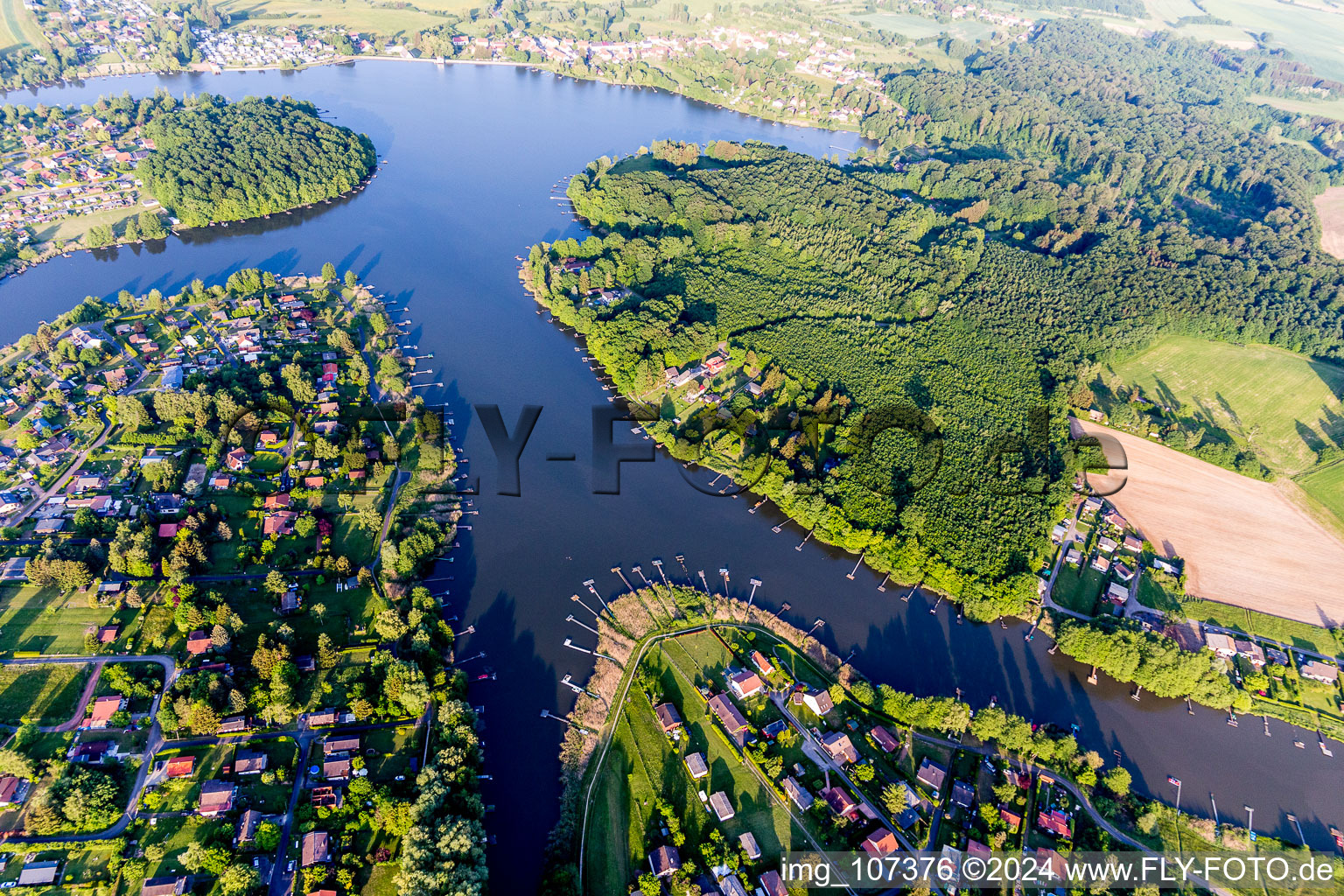 Aerial view of Forests on the shores of Lake A?tong de Hirbach with Anglerstegen in Weiherfeld in Grand Est, France