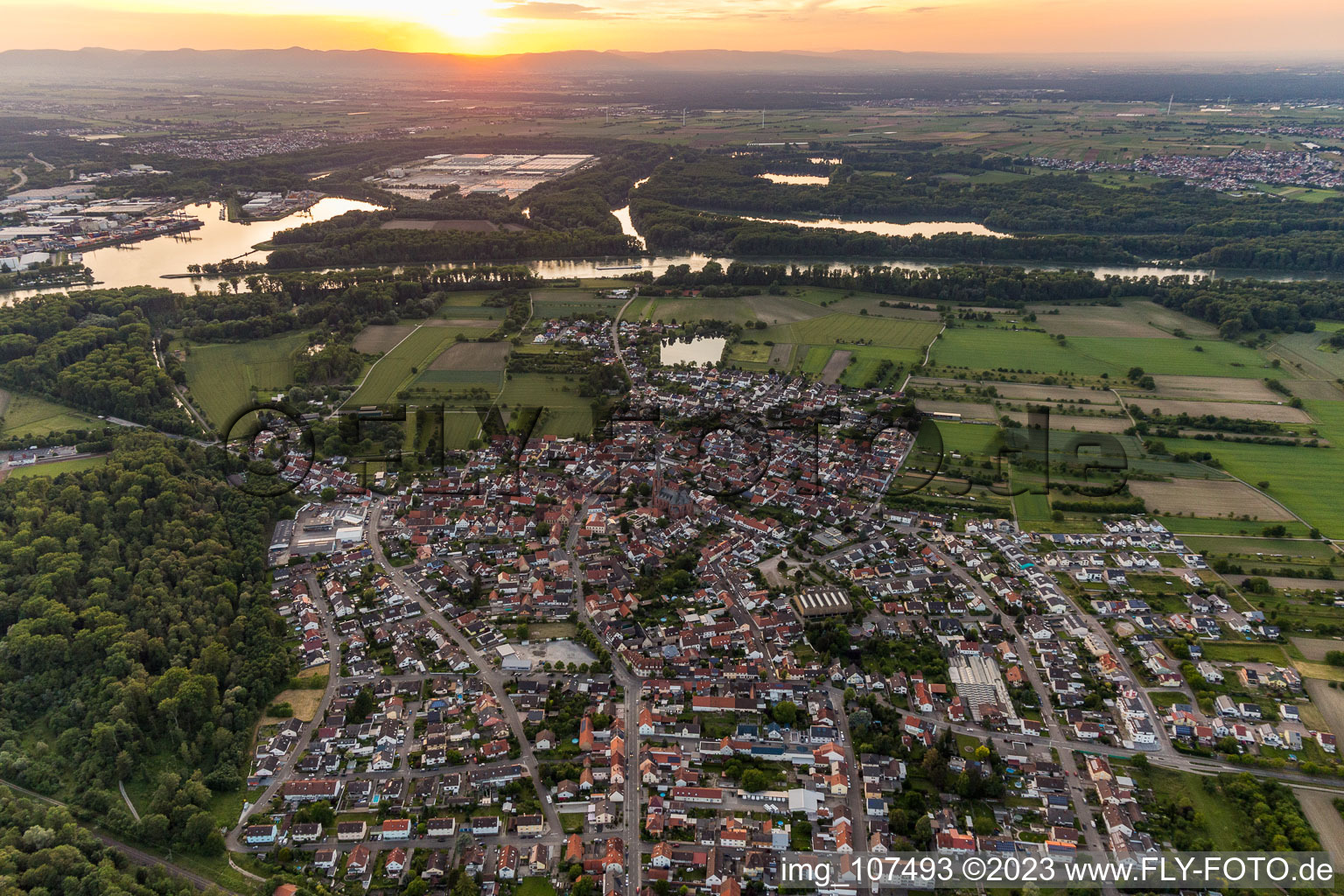 From the east at sunset in the district Rheinsheim in Philippsburg in the state Baden-Wuerttemberg, Germany