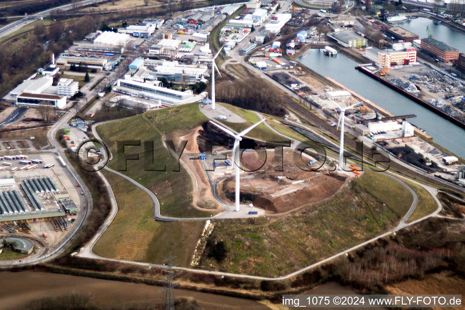 Wind turbines on the garbage mountain in the district Rheinhafen in Karlsruhe in the state Baden-Wuerttemberg, Germany