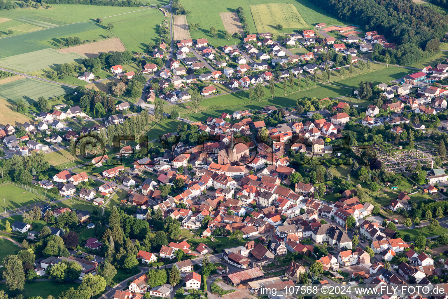 Village view on the edge of agricultural fields and land in Mudau in the state Baden-Wurttemberg, Germany