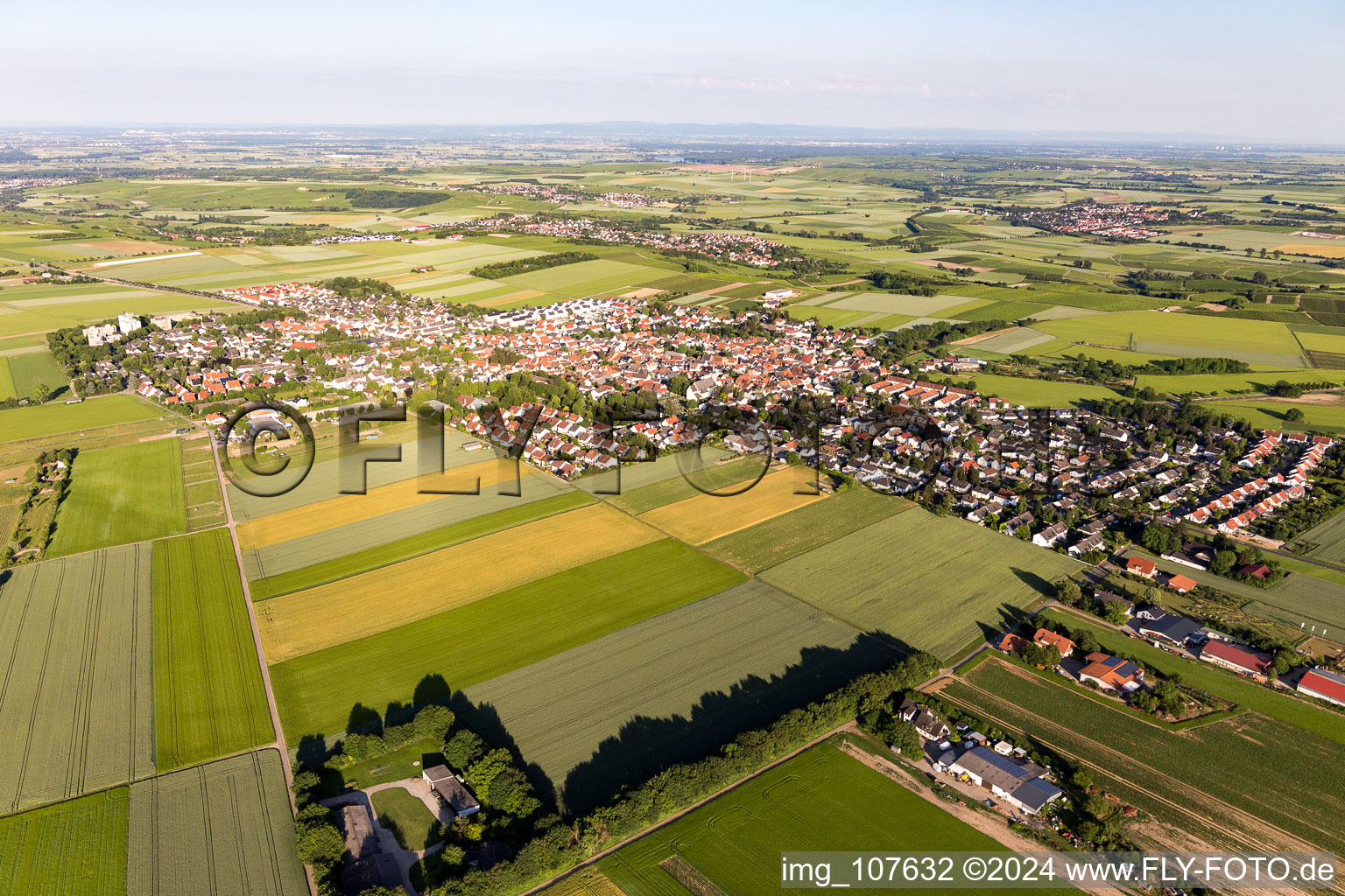 Village view on the edge of agricultural fields and land in Mainz-Ebersheim in the state Rhineland-Palatinate, Germany