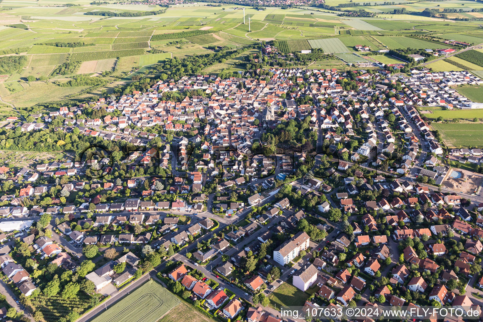 Village view on the edge of agricultural fields and land in Zornheim in the state Rhineland-Palatinate, Germany