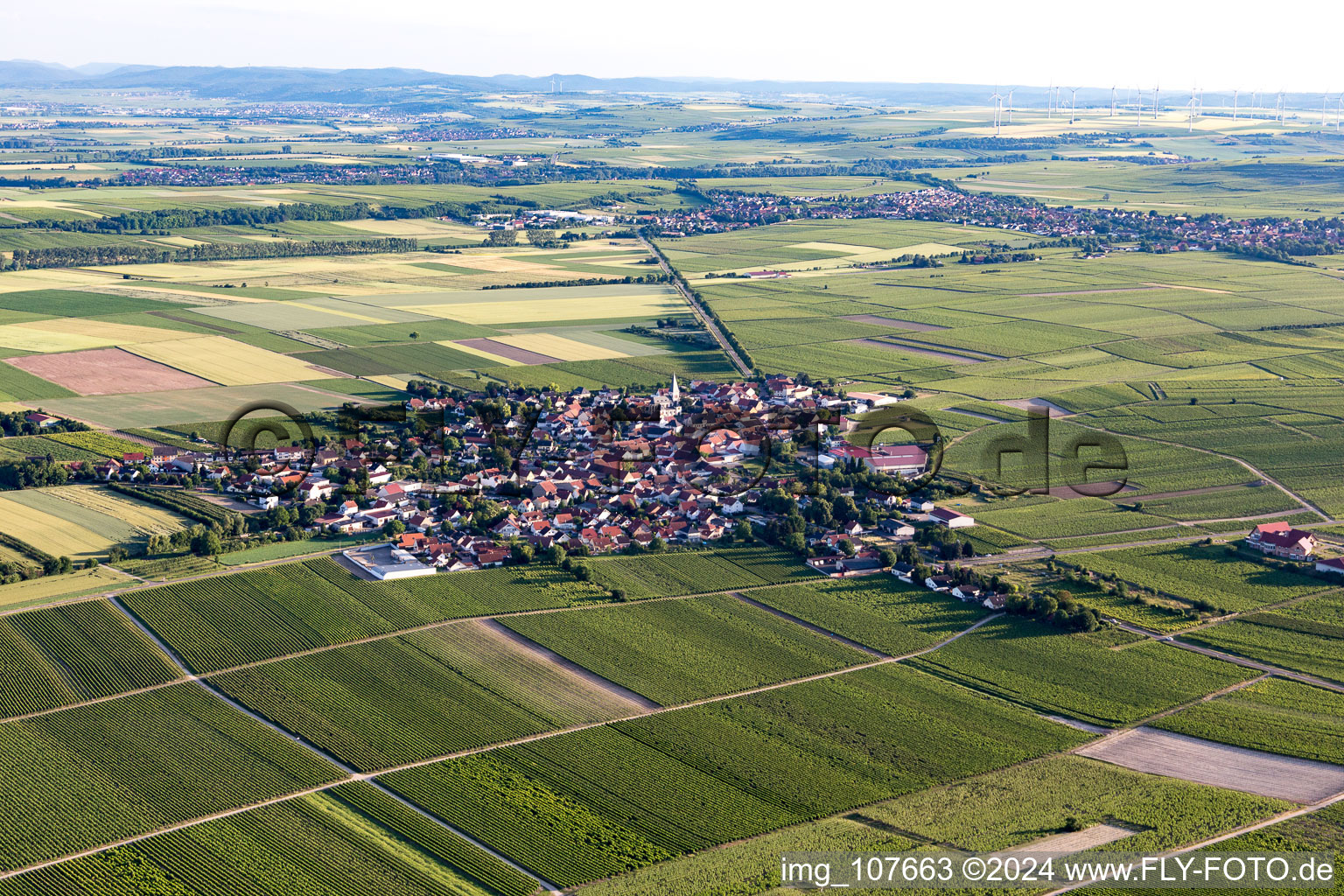 Agricultural land and field borders surround the settlement area of the village in Gundheim in the state Rhineland-Palatinate, Germany