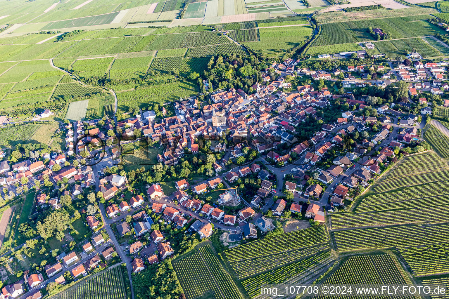 Aerial view of Village view on the edge of agricultural fields and land in Grosskarlbach in the state Rhineland-Palatinate, Germany