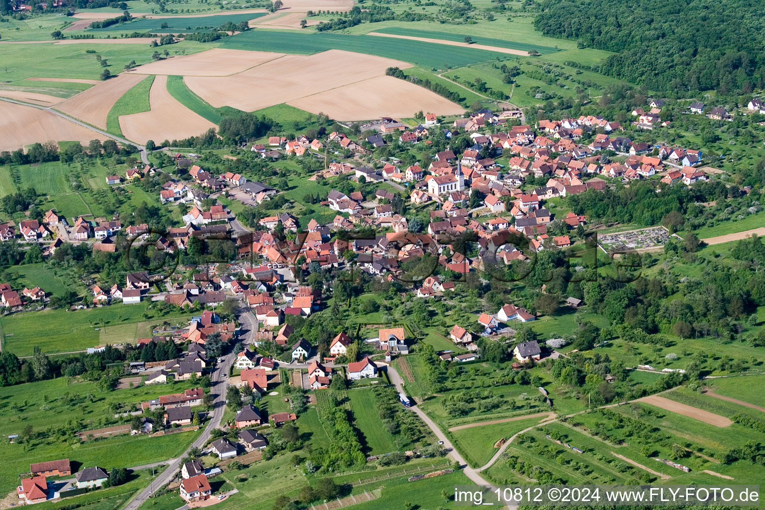 Aerial photograpy of Village - view on the edge of agricultural fields and farmland in Lampertsloch in Grand Est, France