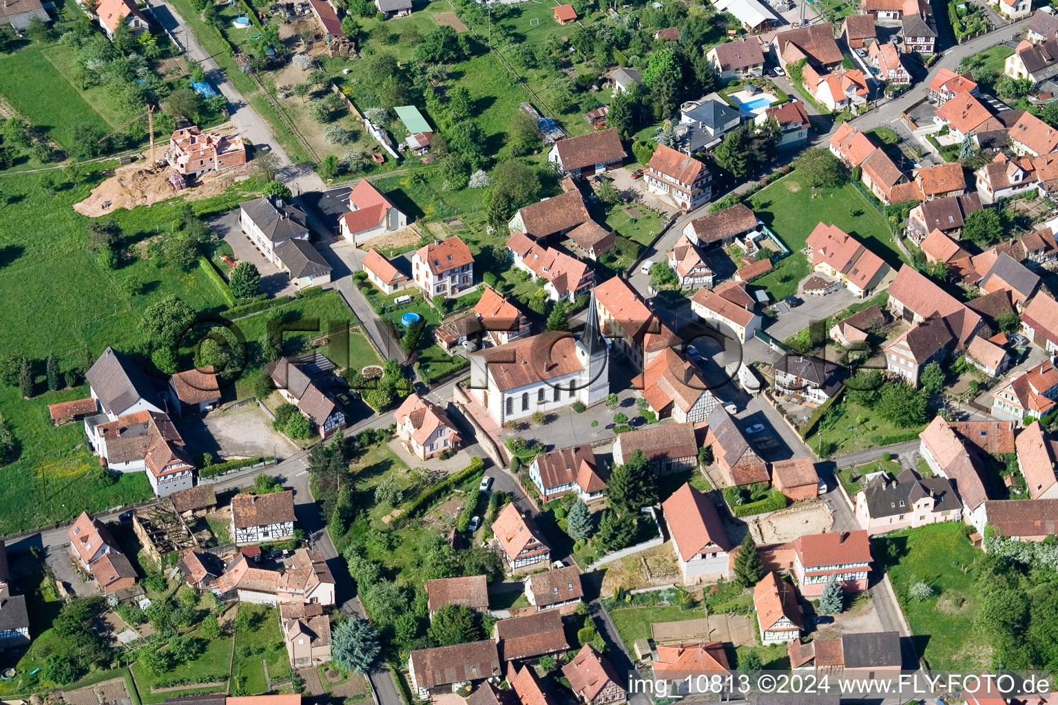 Aerial view of Church building in the village of in Lampertsloch in Grand Est, France