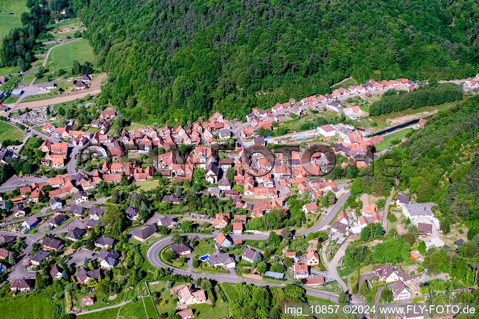 Aerial photograpy of Village - view on the edge of agricultural fields and farmland in Rothbach in Grand Est, France