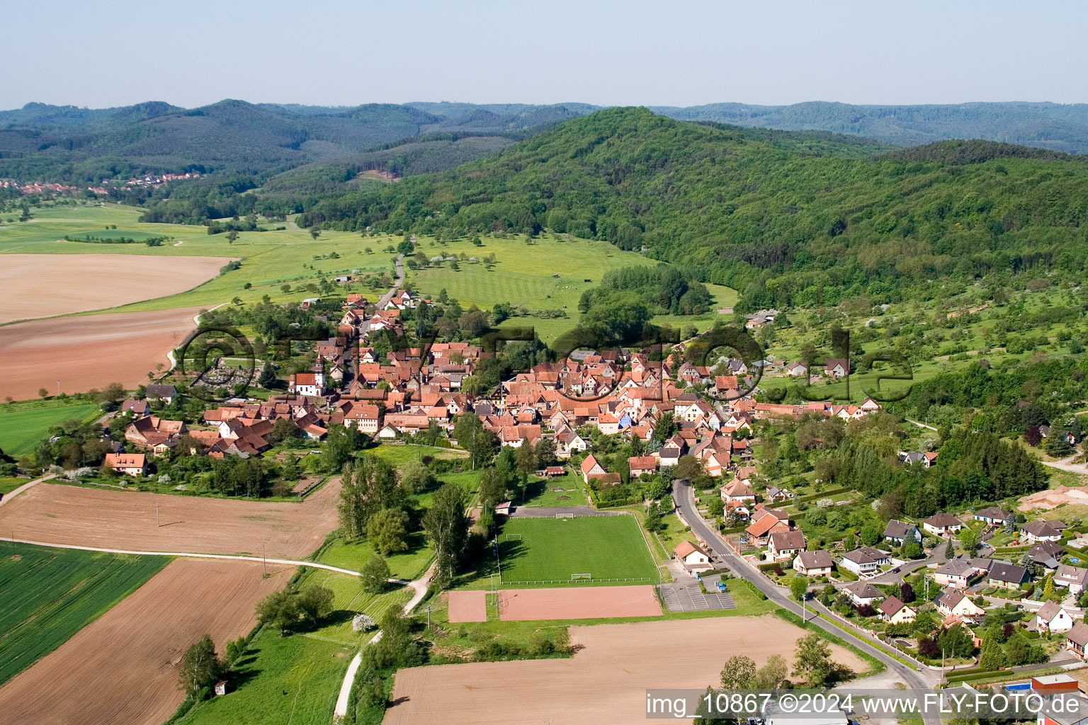 Village - view on the edge of agricultural fields and farmland in Weinbourg in Grand Est, France