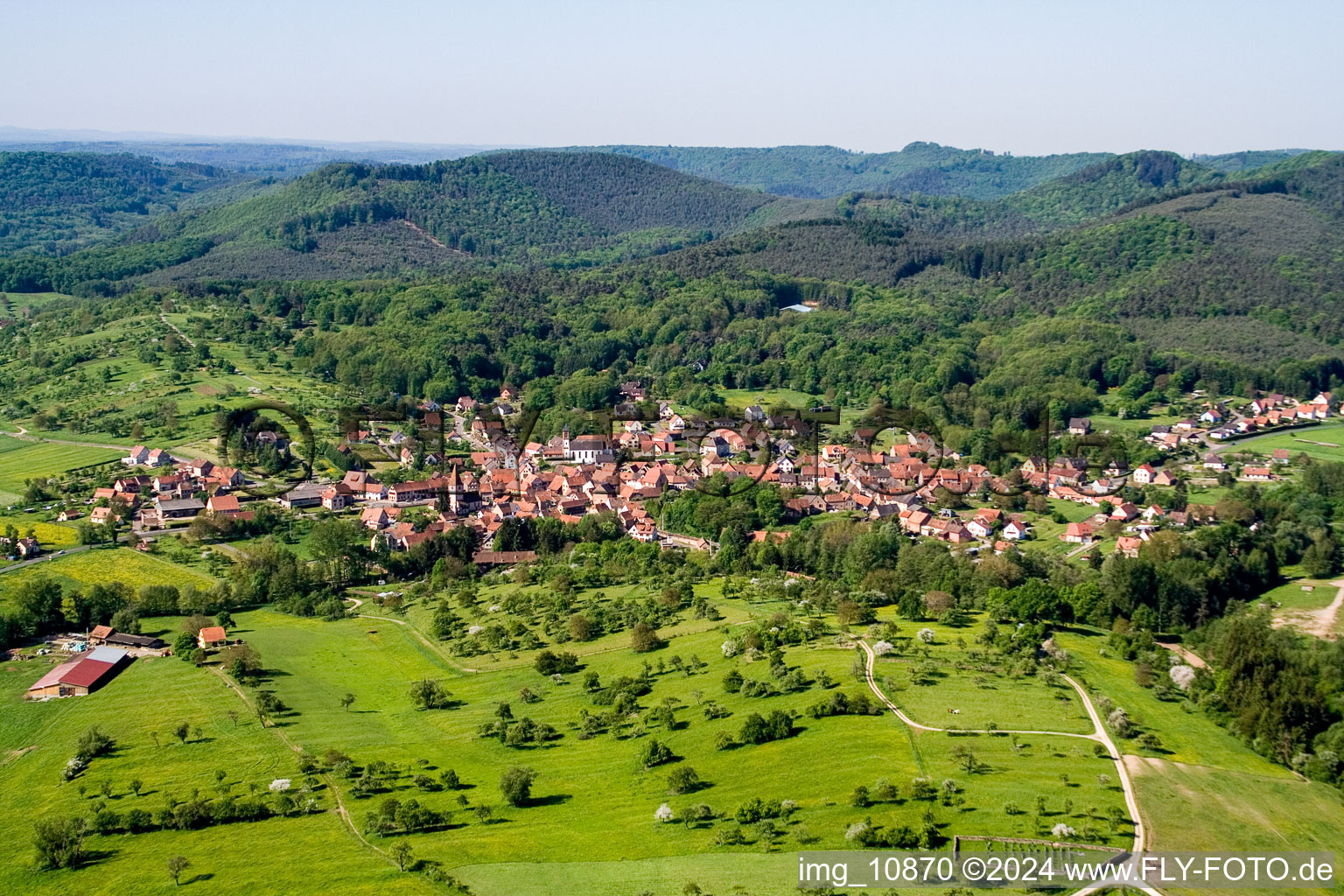 Village - view on the edge of agricultural fields and farmland in Weiterswiller in Grand Est, France