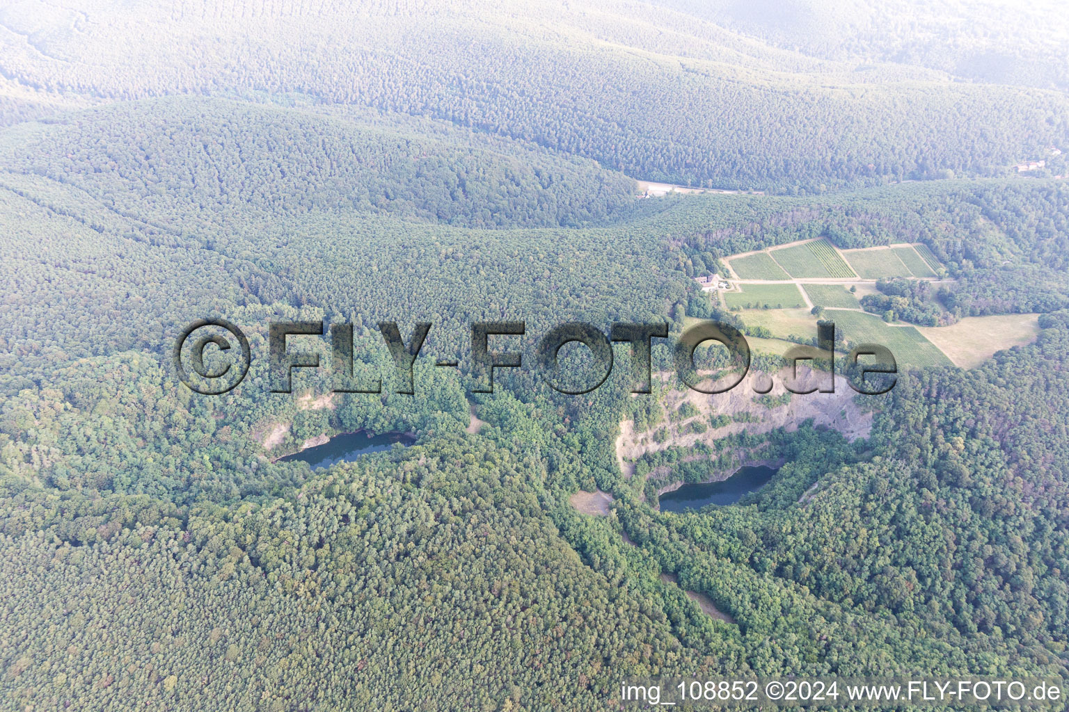 Oblique view of Basalt lake, old quarry in Wachenheim an der Weinstraße in the state Rhineland-Palatinate, Germany