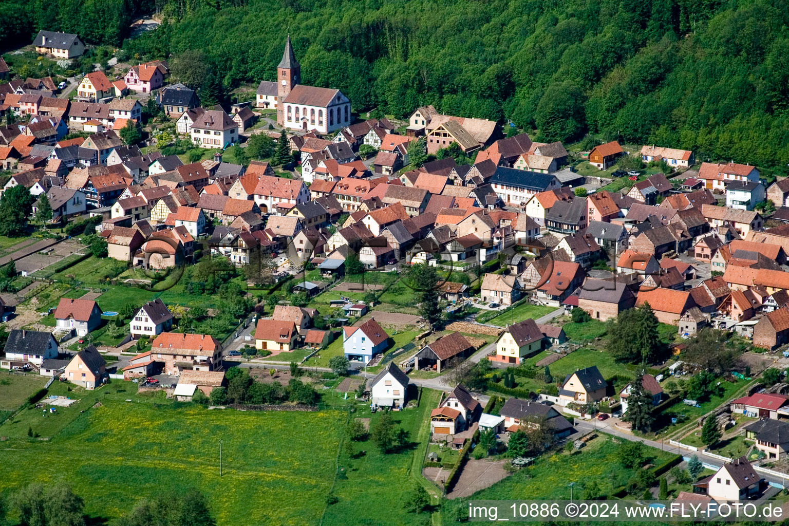 Aerial view of Village - view on the edge of agricultural fields and farmland in Ernolsheim-lA?s-Saverne in Grand Est, France