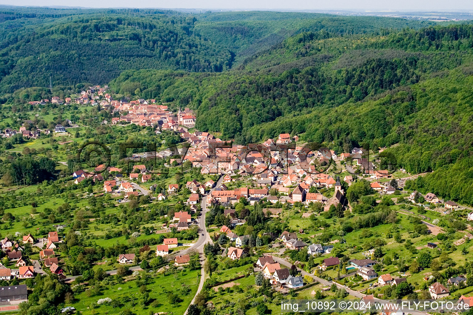 Village - view on the edge of agricultural fields and farmland in Saint-Jean-Saverne in Grand Est, France