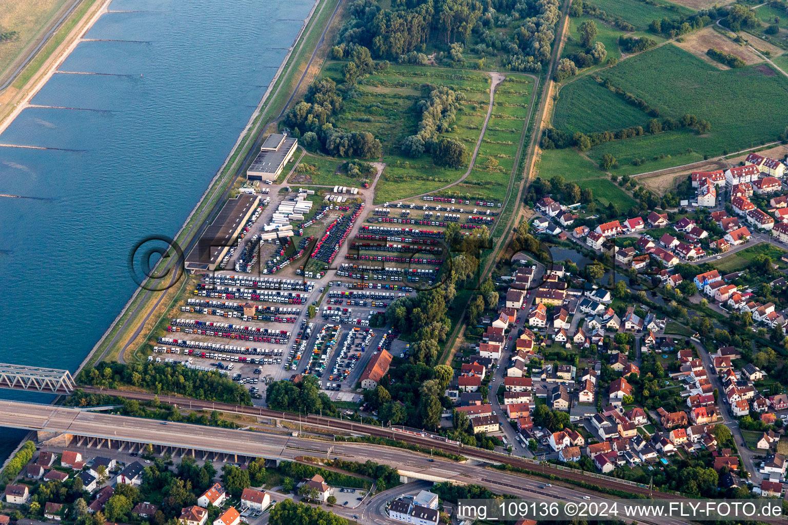 Truck storage on the Rhine in the district Maximiliansau in Wörth am Rhein in the state Rhineland-Palatinate, Germany