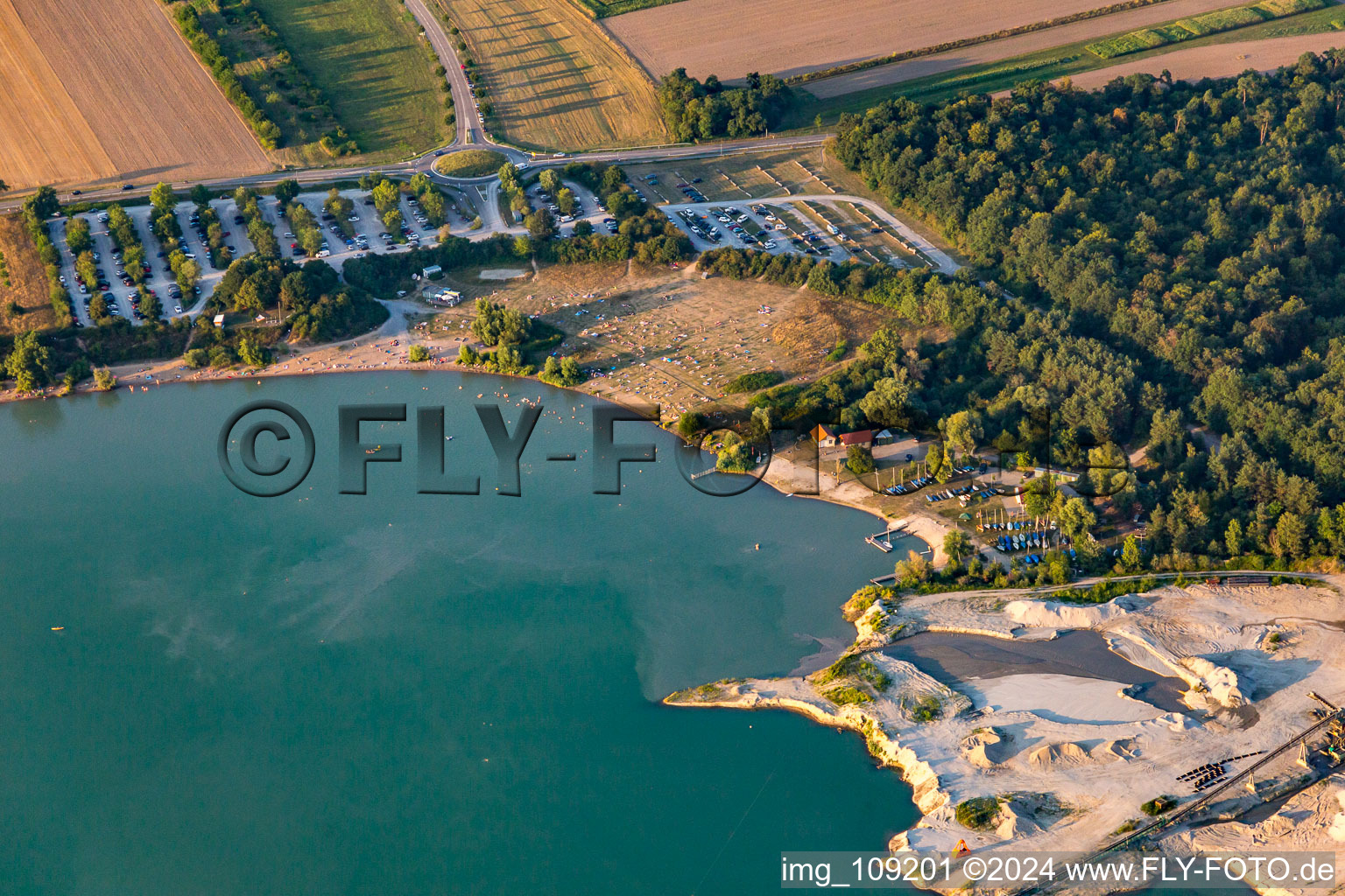 Bathers in and on the beach of Epplesee in the district Silberstreifen in Rheinstetten in the state Baden-Wuerttemberg, Germany