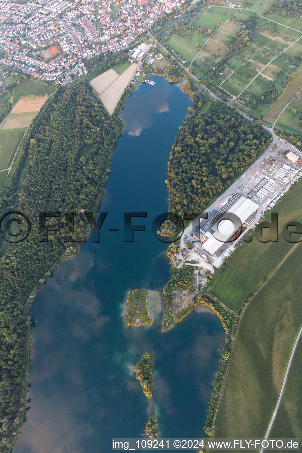 Rohrköpfle quarry lake, Schlangenlach industrial estate in Linkenheim-Hochstetten in the state Baden-Wuerttemberg, Germany