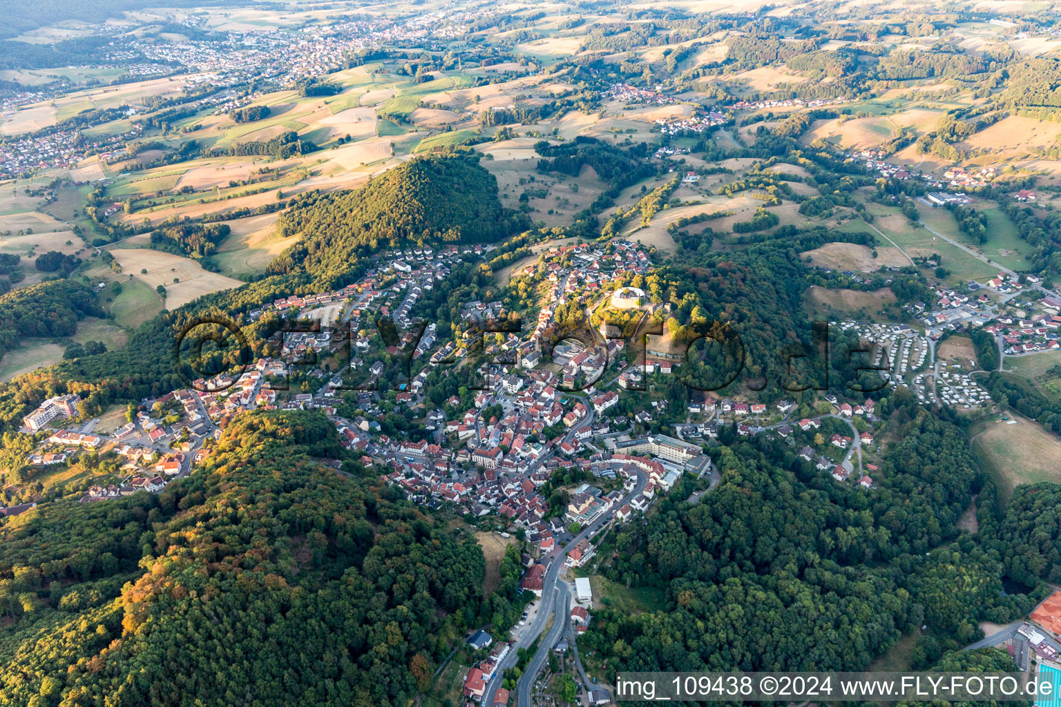 Location view of the streets and houses of residential areas in the valley landscape surrounded by mountains in Lindenfels in the state Hesse, Germany