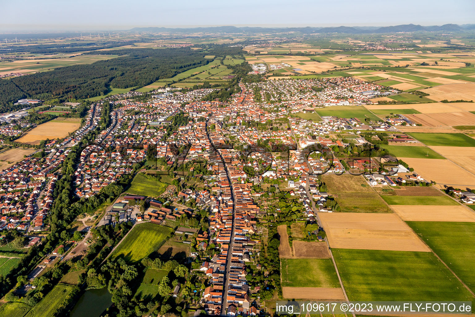 Village view on the edge of agricultural fields and land in Herxheim bei Landau (Pfalz) in the state Rhineland-Palatinate, Germany