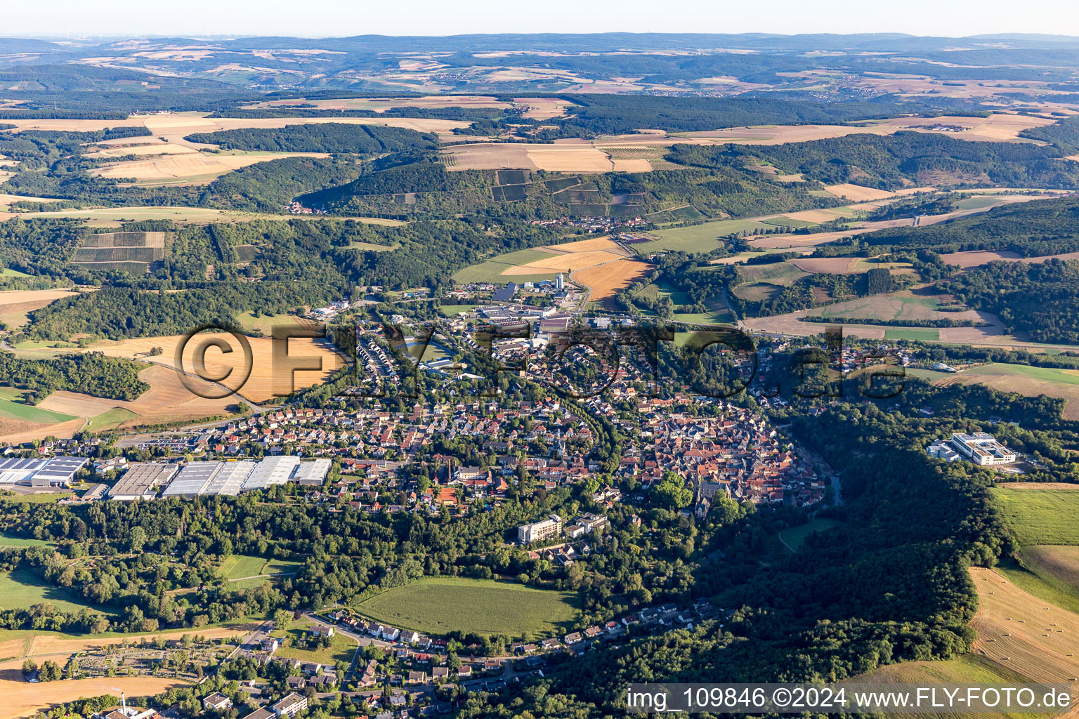Location view of the streets and houses of residential areas in the Glan valley landscape surrounded by hills in Meisenheim in the state Rhineland-Palatinate, Germany
