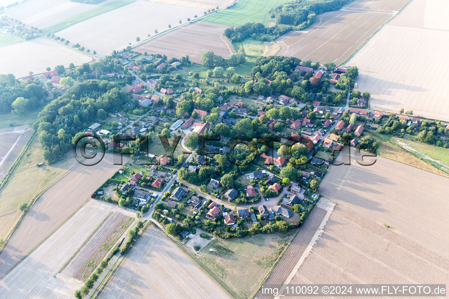 Agricultural land and field borders surround the settlement area of the village in Natendorf in the state Lower Saxony, Germany