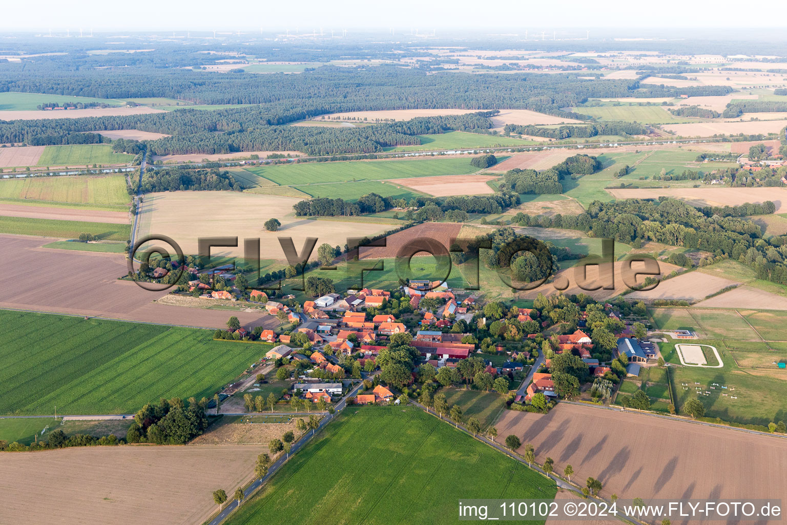 Agricultural land and field borders surround the settlement area of the village in Bienenbuettel in the state Lower Saxony, Germany