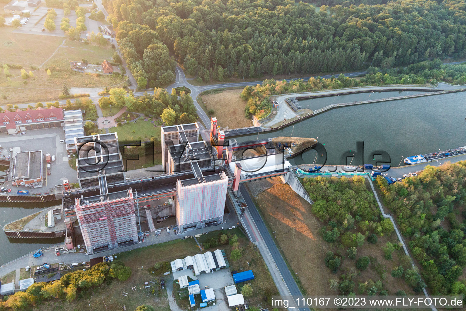 Boat lift and locks plants on the banks of the waterway of the Elbe side channel in Scharnebeck in the state Lower Saxony, Germany viewn from the air