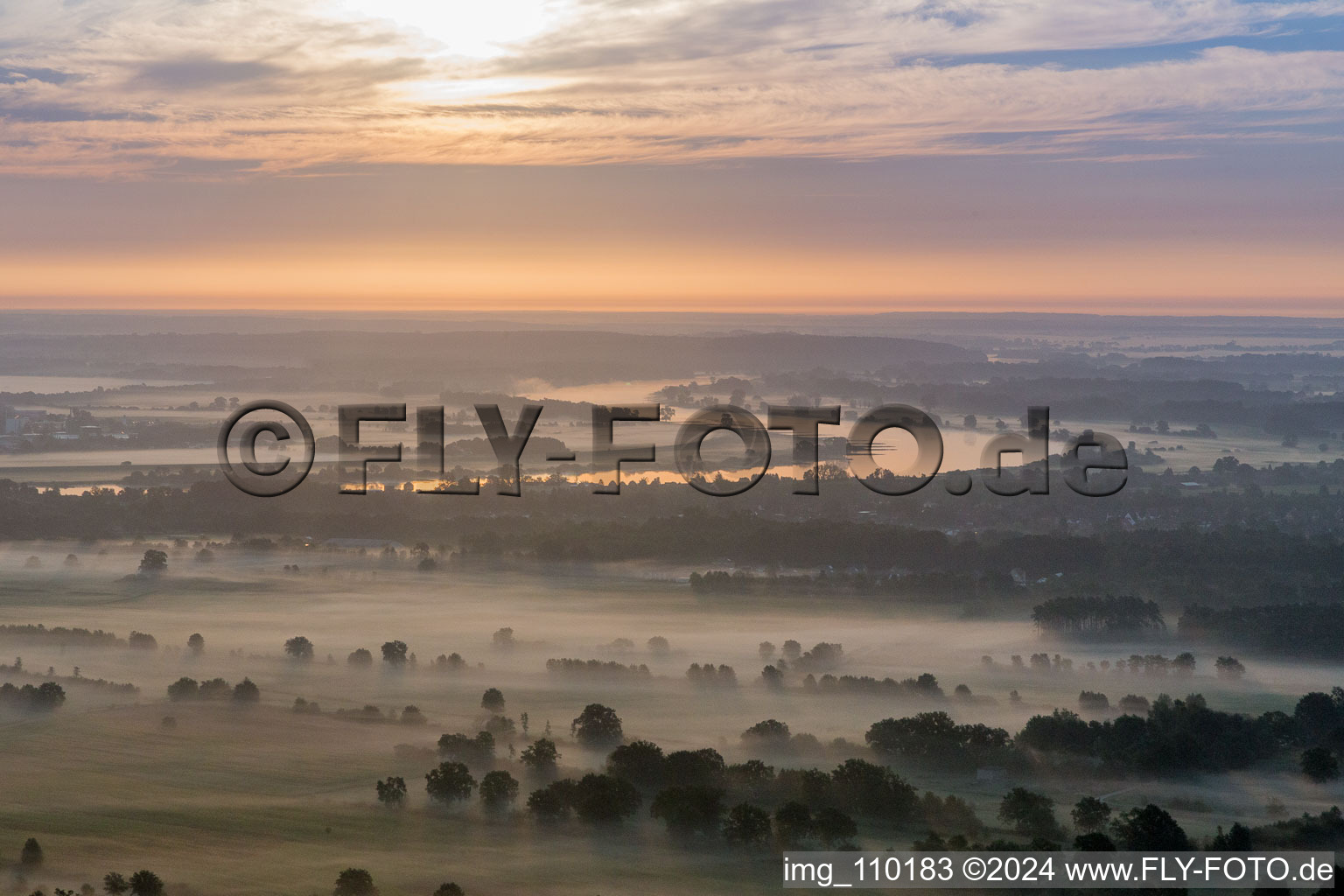 Morning mist ovr the curved loop of the riparian zones on the course of the river Elbe near Boizenburg in Hohnstorf (Elbe) in the state Lower Saxony, Germany