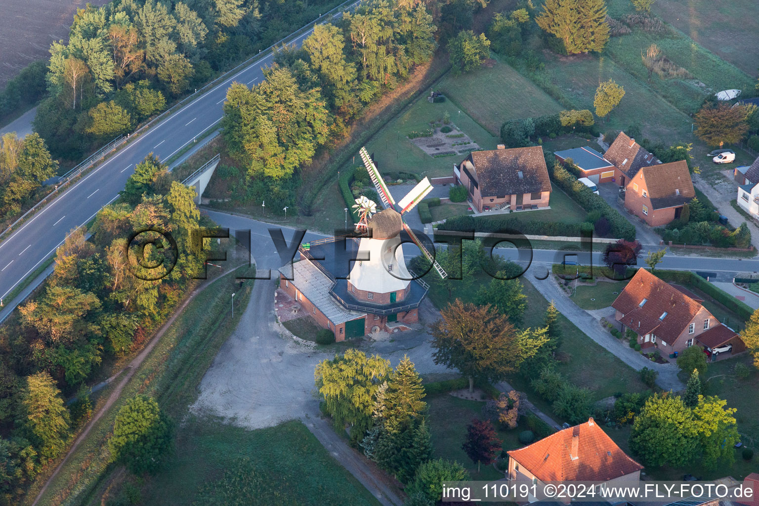 Historic windmill on a farm homestead on the edge of cultivated fields in Artlenburg in the state Lower Saxony, Germany