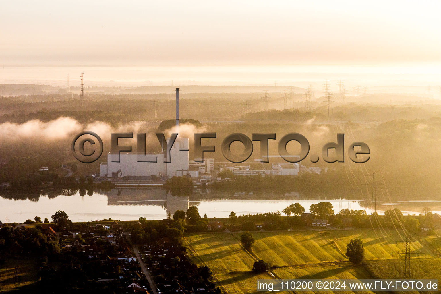 Building the decommissioned reactor units and systems of the NPP - NPP nuclear power plant Kruemmel in morning mist on the Elbe shore in the district Kruemmel in Geesthacht in the state Schleswig-Holstein, Germany