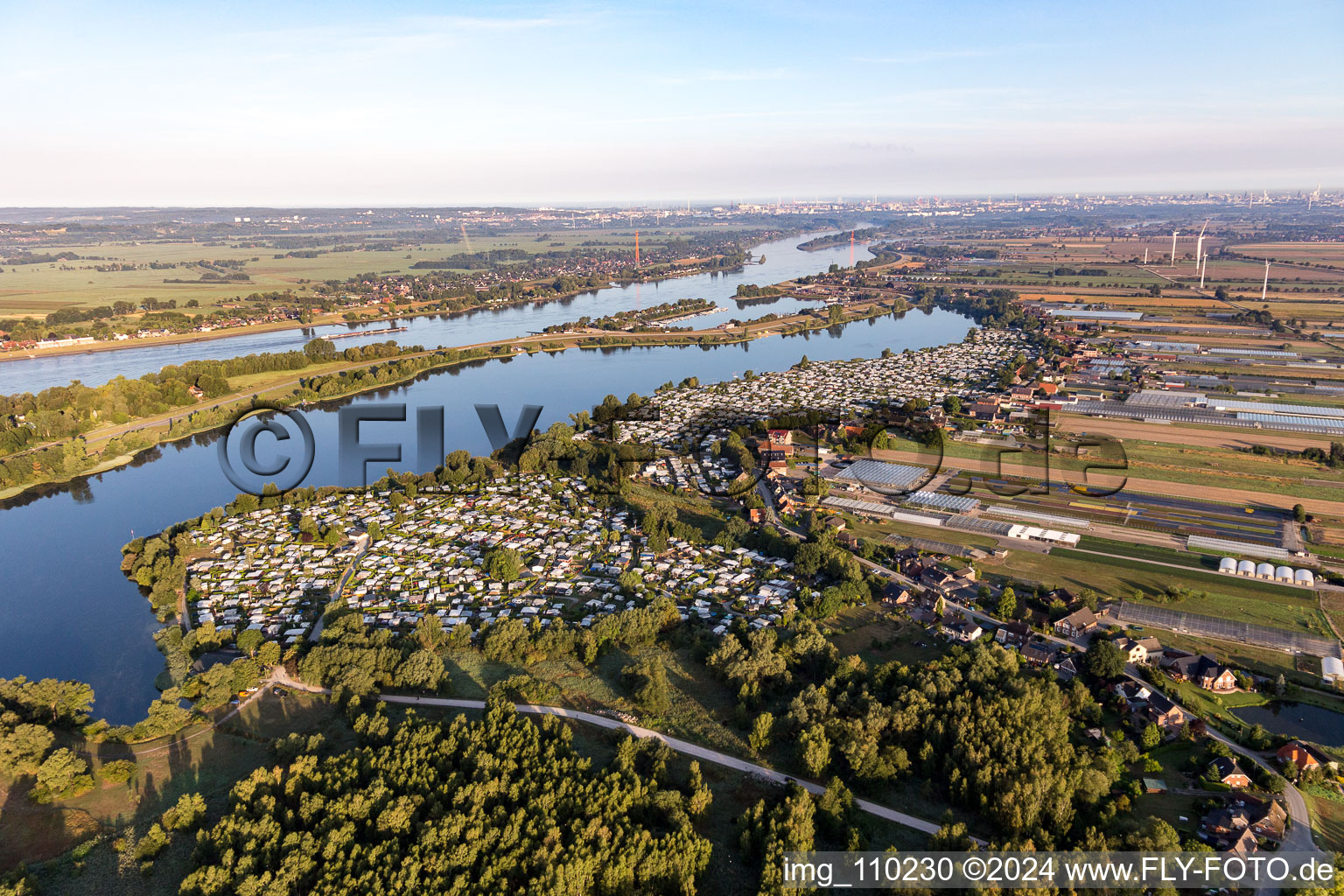 Camping with caravans and tents on the Elbe dyke in the district Ochsenwerder in Hamburg, Germany